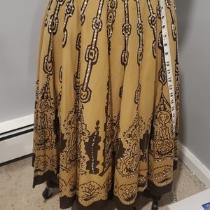 Fully lined, full circle embellished skirt.